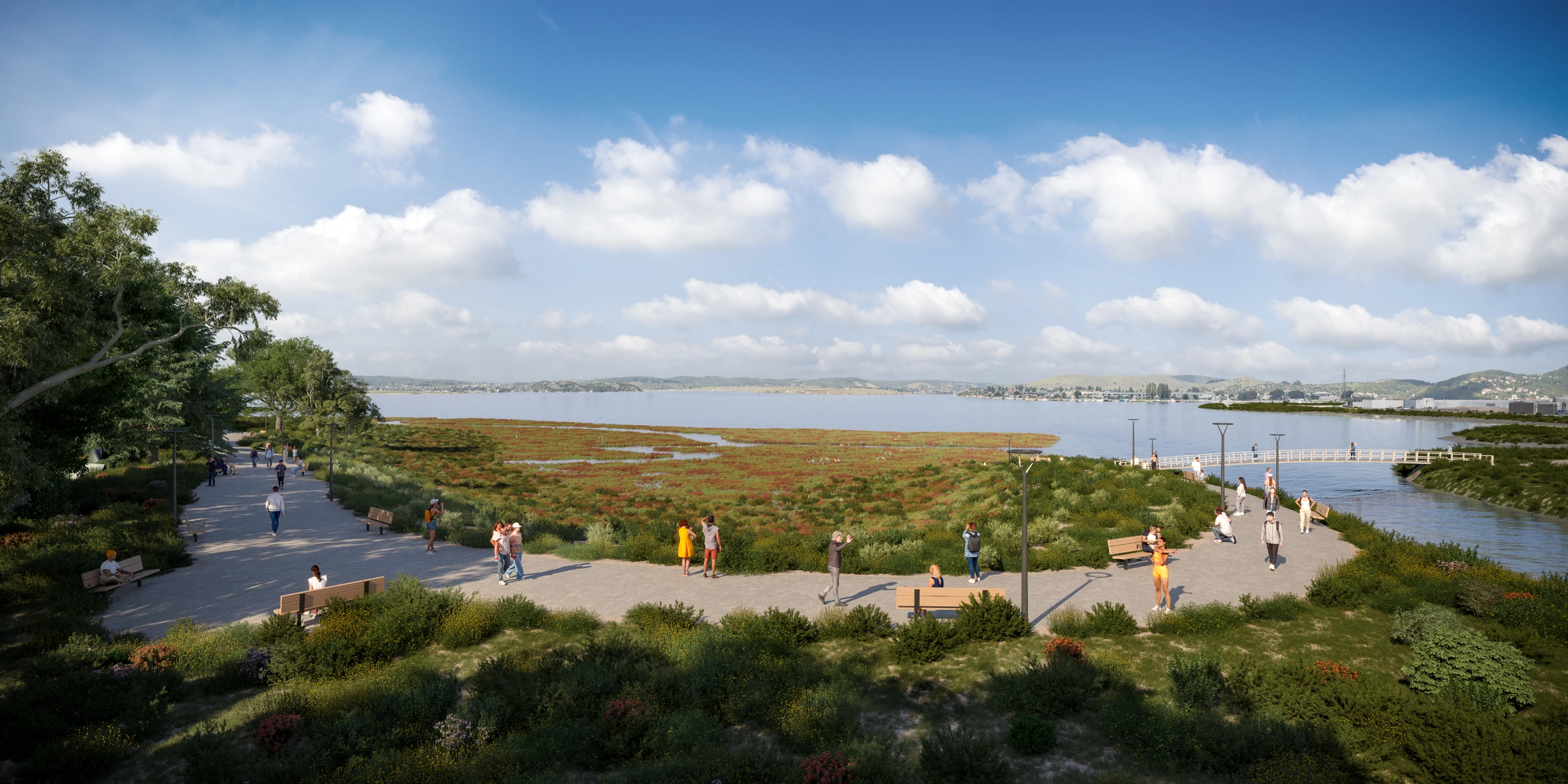 Scenic bayfront walking path featuring native landscaping and observation pier