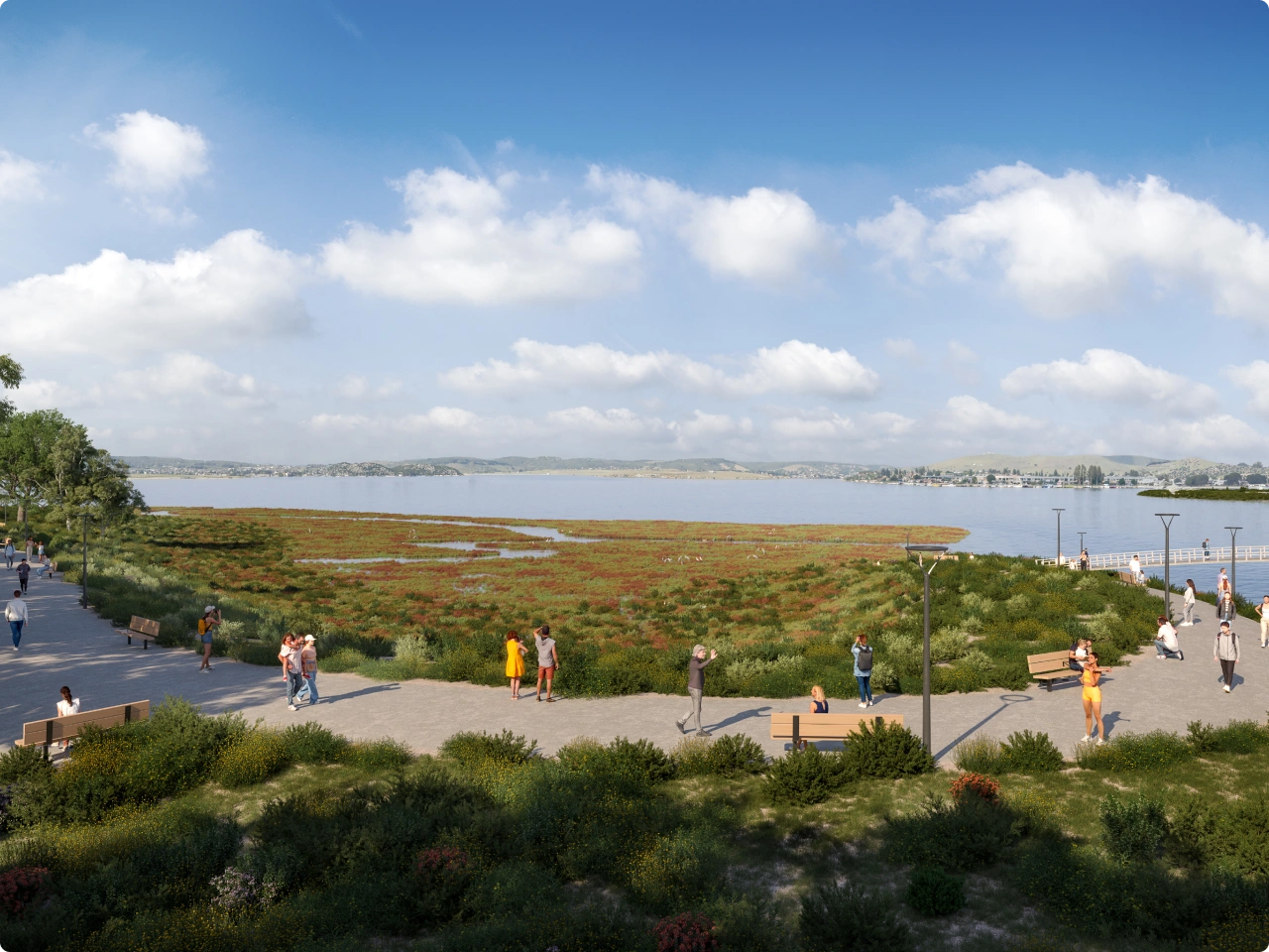 Community gathering space along coastal wetland under blue sky